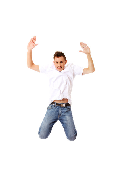 Young guy jumping from happiness - Photo, Image