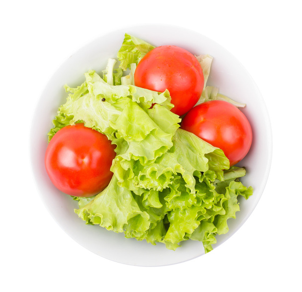 tomatoes and greens in a plate - Foto, Imagem