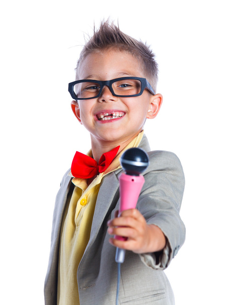 Boy singing with a microphone - Фото, изображение