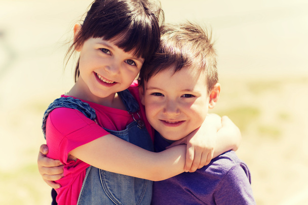 two happy kids hugging outdoors - Foto, Imagem