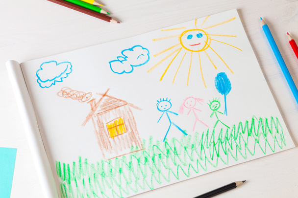 Child draws a pencil drawing of the house and his family. - Photo, Image
