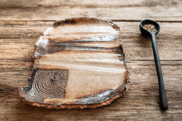 Empty rustic handmade eco friendly pottery plate - 写真・画像