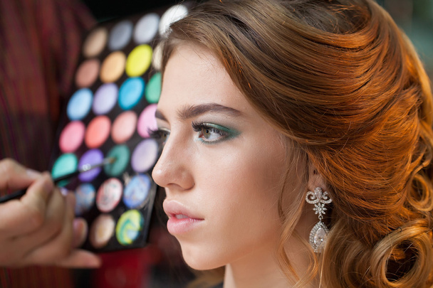 Pretty woman with makeup and palette - 写真・画像