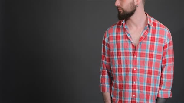 Bearded man keeps his hand in pockets - Footage, Video