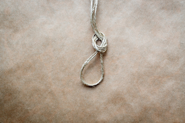 concept hangmans knot on kraft paper background - Zdjęcie, obraz