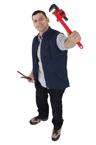 Plumber holding his favorite wrench - Zdjęcie, obraz