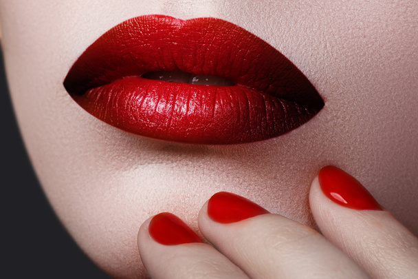 Red Sexy Lips and Nails closeup. Open Mouth. Manicure and Makeup. Make up concept. Beauty model girl's face isolated on white background. Filler injections. Lip augmentation, Beautiful Perfect Lips - Foto, imagen