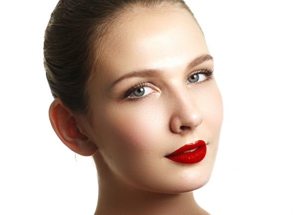 Close-up shot of woman lips with red lipstick. Beautiful perfect lips. Sexy mouth close up. Beautiful wide smile of young fresh woman with full lips. Isolated over white background - Photo, Image