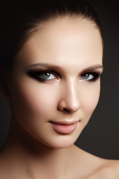 Beautiful woman with bright make up eye with sexy liner makeup. Fashion big arrow shape on woman's eyelid. Chic evening make-up, healthy face - Photo, image