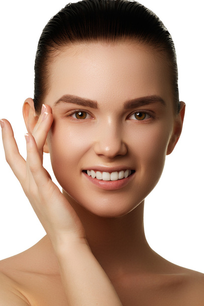 Beauty Woman face portrait. Beautiful spa model girl with perfect fresh clean skin. Female looking at camera and smiling. Youth and skin care - Photo, Image