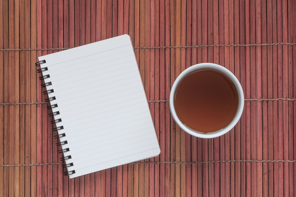 Blank note book with a cup - Photo, Image