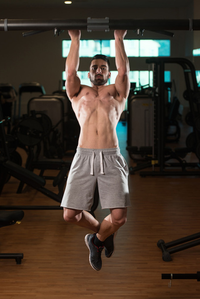 Young Man Doing Exercise For Back - Foto, Imagen