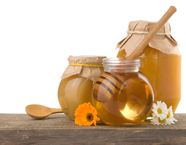 Honey in jar isolated on white background - Valokuva, kuva