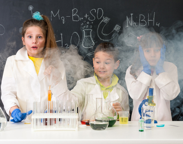 three excited children after chemical experiment - Photo, Image