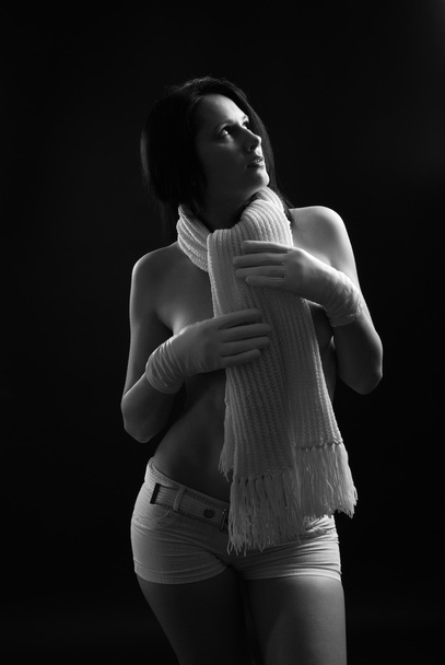 Nude woman in warm scarf on the neck. - Foto, afbeelding