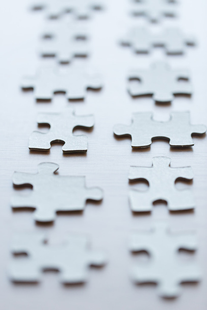 close up of puzzle pieces on table - Fotografie, Obrázek