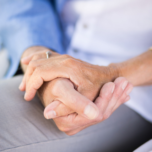 Senior couple holding hands - Foto, Imagen