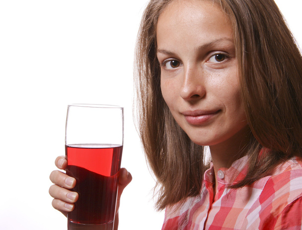 Young woman with glass of red drink - Фото, зображення
