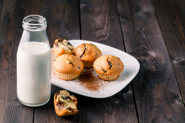 Breakfast with pastry and milk in bottle - 写真・画像