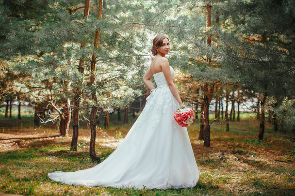 Bride in park outdoors - Фото, изображение