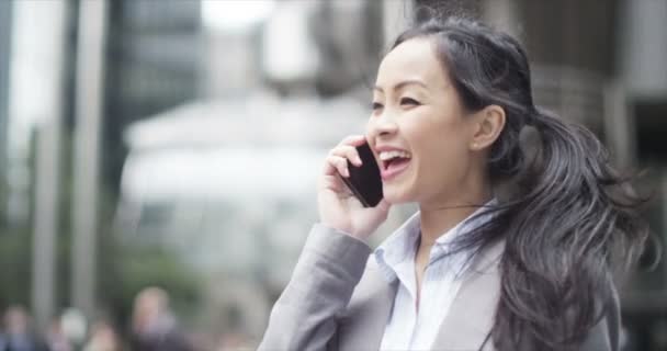 businesswoman talking on mobile phone - Кадри, відео