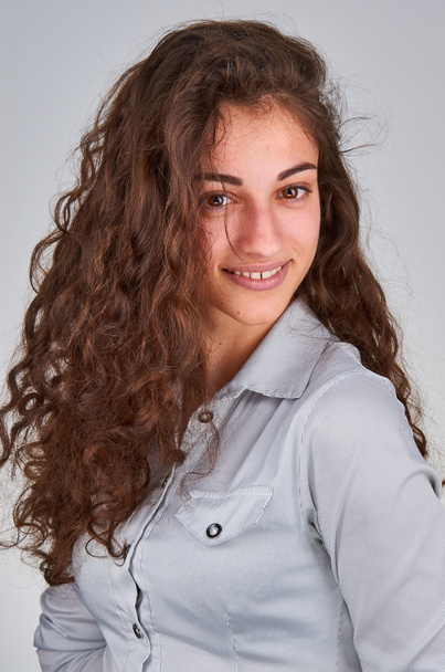 Young curly girl with brown eyes  - Fotó, kép