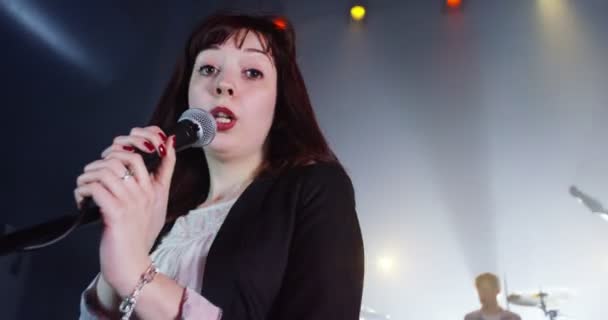 singer performing with band at music event - Video, Çekim
