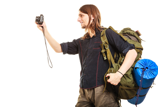 Man tourist backpacker taking photo with camera. - Fotografie, Obrázek