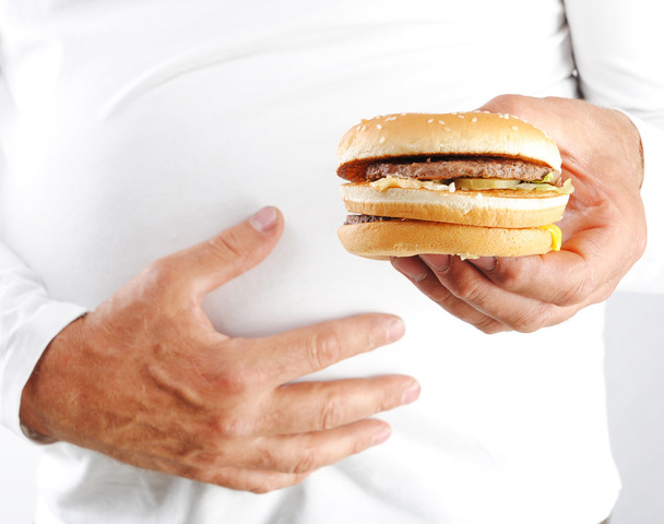 Men's hands hold the burger. Close-up - Photo, image