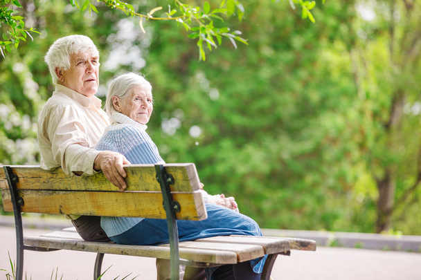 Elderly couple resting on a bench - Photo, Image
