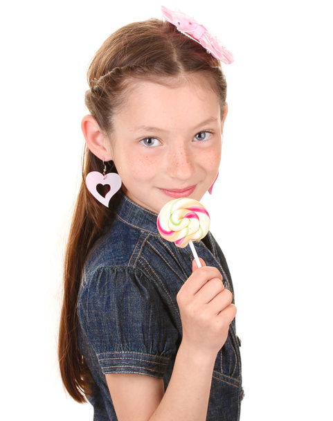Portrait of beautiful little girl with lollipop isolated on white - Fotó, kép