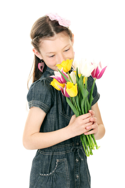Portrait of beautiful little girl with tulips isolated on white - Zdjęcie, obraz