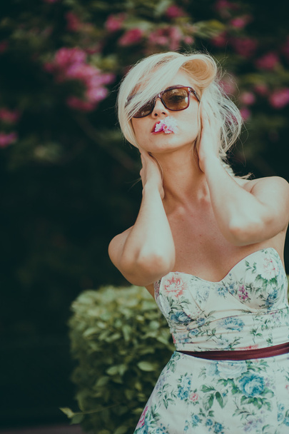beautiful blond girl in garden - Fotografie, Obrázek