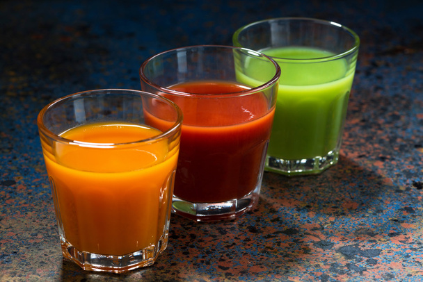 vegetable juices in glass beakers - Фото, изображение