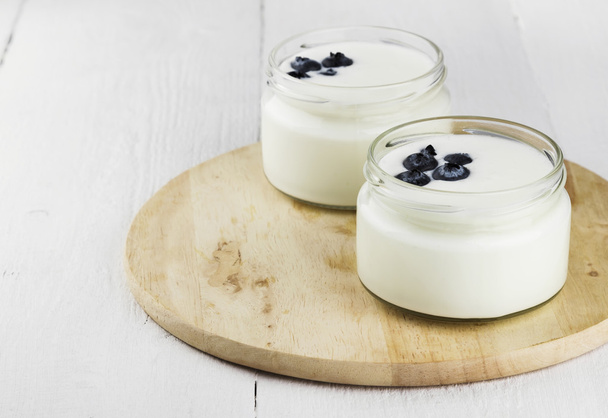 Yogurt with blueberry on a white background - Foto, Imagen