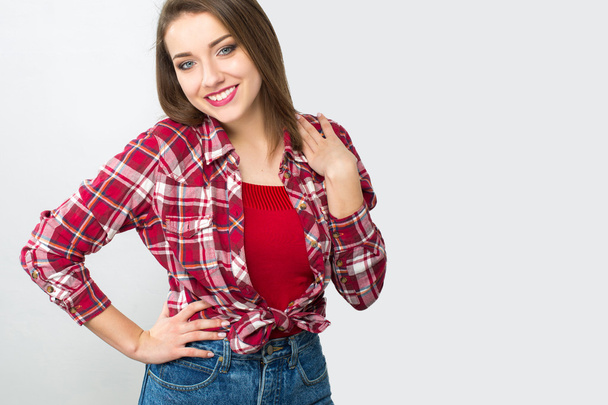 Fashion model with straight hair wearing plaid  shirt  - Foto, afbeelding