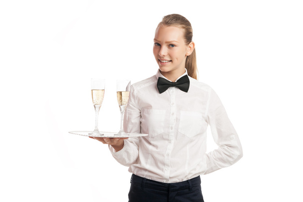Portrait of young blonde waitress holding tray with two glasses - Photo, Image