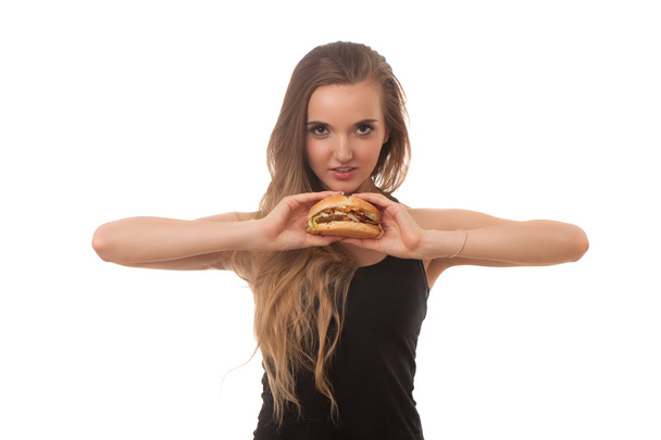 young beautiful girl with a Burger in hand isolated on white background - Φωτογραφία, εικόνα