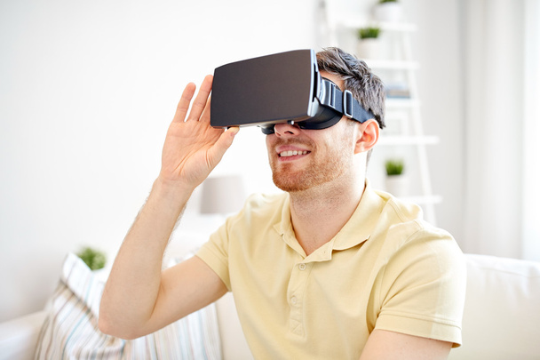 young man in virtual reality headset or 3d glasses - Foto, Imagen