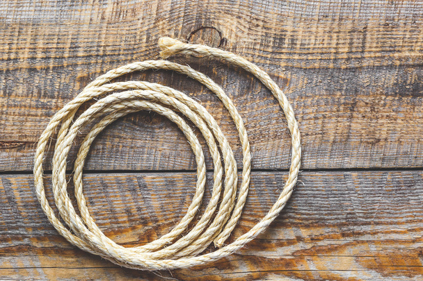 rope gyrate on a wooden table - Φωτογραφία, εικόνα
