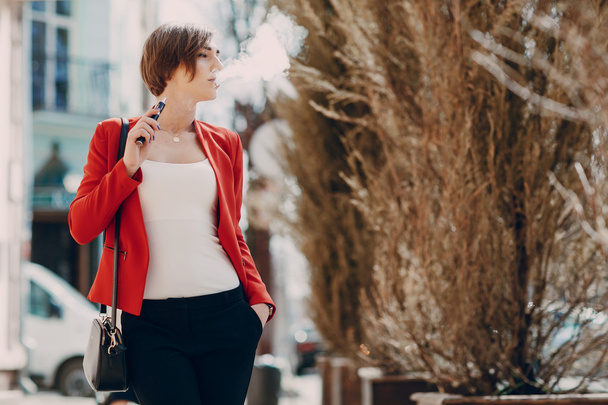 girl with the electronic cigarette - Zdjęcie, obraz