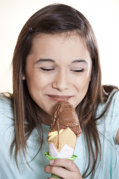 Girl With Eyes Closed Enjoying Chocolate Ice Cream - Photo, Image