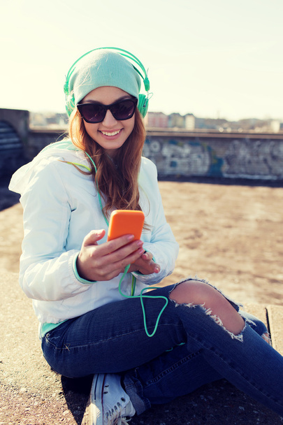happy young woman with smartphone and headphones - Fotoğraf, Görsel