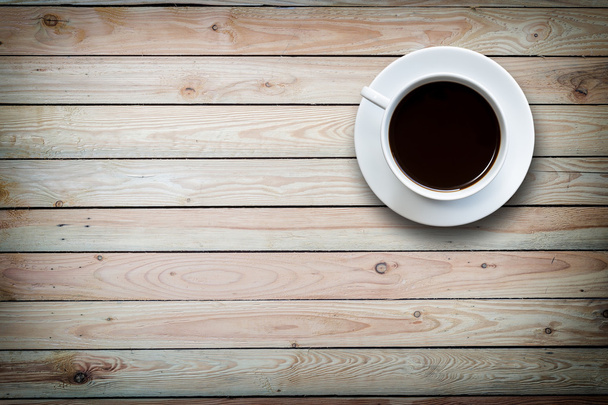 White coffee cup on wooden table top view  - Photo, Image