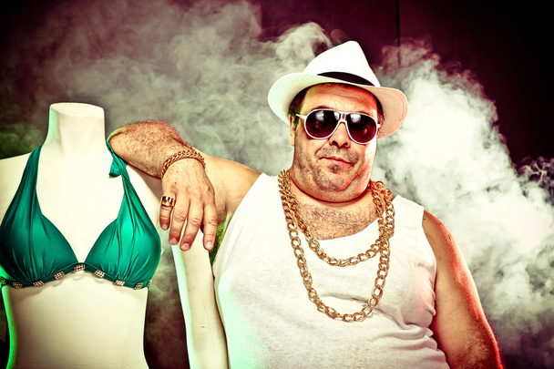 italian funny mafia boss rapper with undershirt and sunglasses on smoky background - Fotoğraf, Görsel