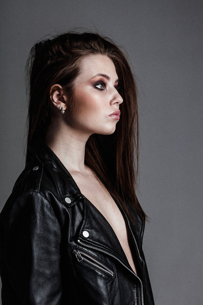 young pretty sexy woman in leather jacket - Фото, изображение