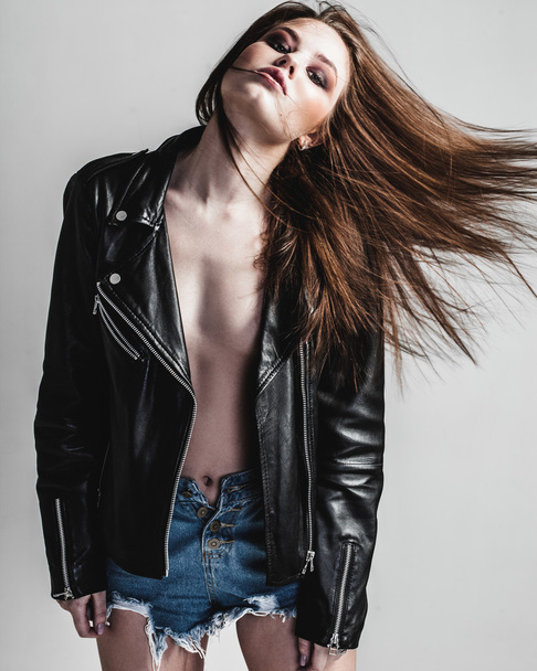 young pretty sexy woman in leather jacket - Фото, зображення