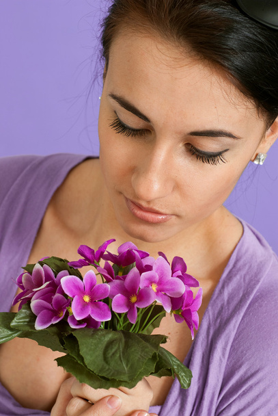Beautiful happy Brunette Caucasian with flowers - Foto, imagen