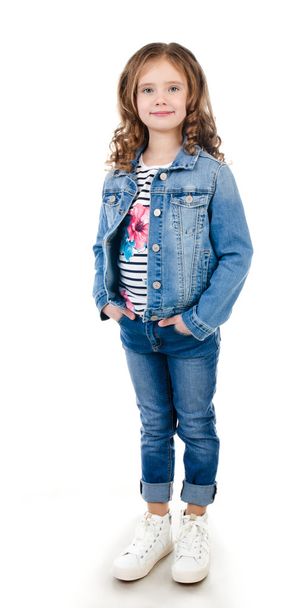 Portrait of adorable happy little girl in jeans  - Fotografie, Obrázek