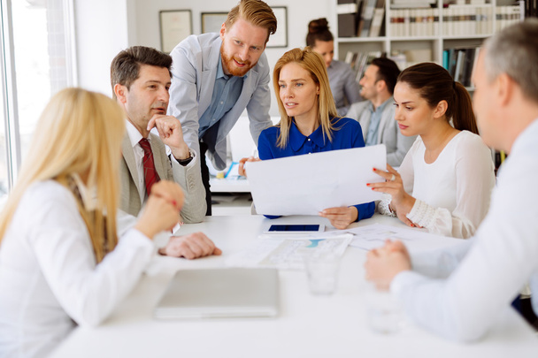 Business people discussing strategies in office - Фото, зображення